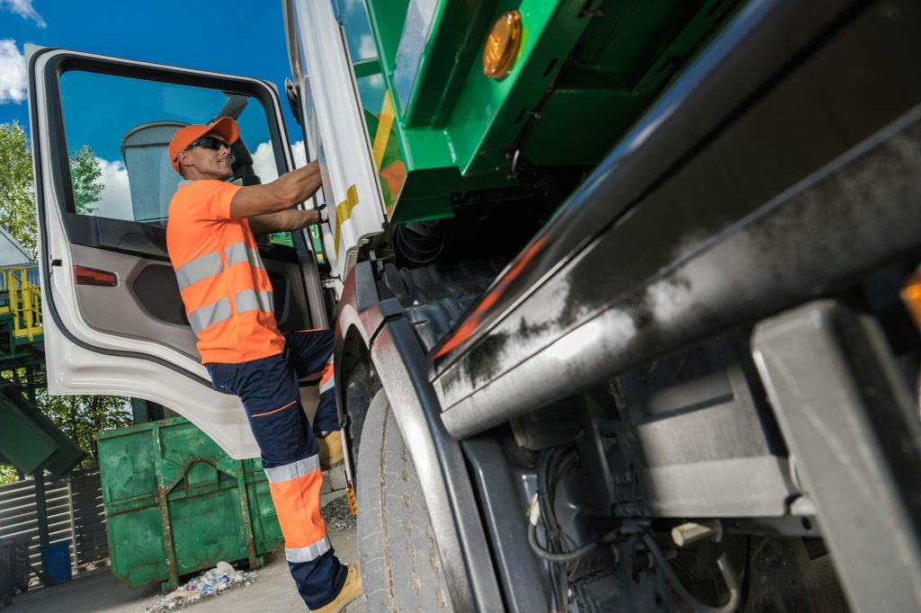 Garbage Truck Driver and City Garbage Collecting